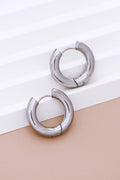Close-up detail of the thick, hollow tube design of the Kogi Jewelry silver chunky hoops.