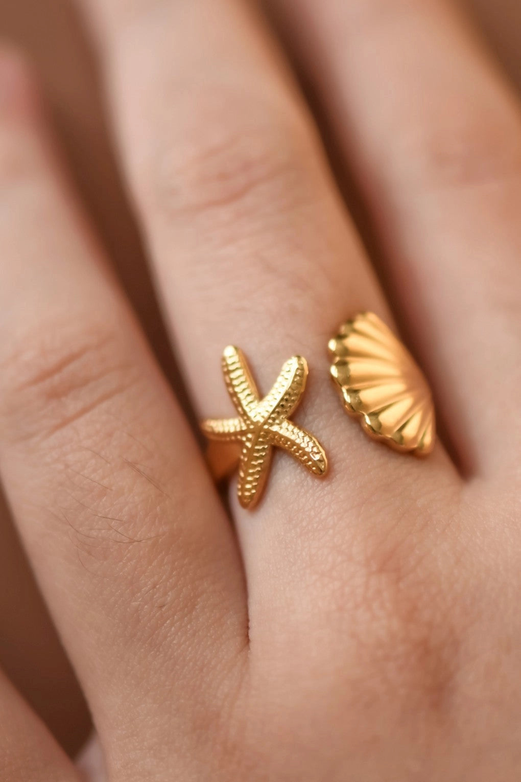 Luxurious gold starfish ring with waterproof finish, ideal for beach-inspired fashion.