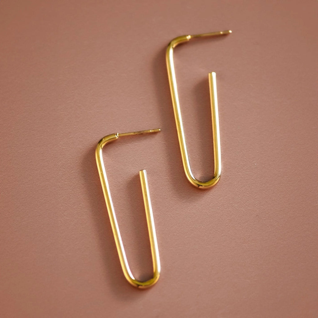 Elegant 1.6 inch gold hoop earrings worn, highlighting their timeless and versatile design.