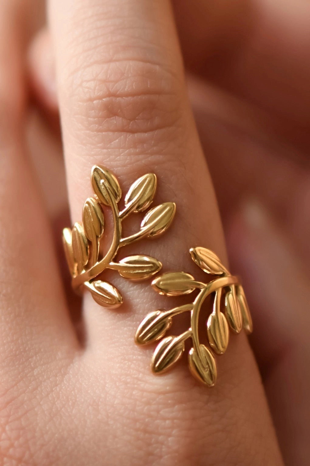 18K gold plated leafy branch ring featuring detailed organic leaf textures in stainless steel.