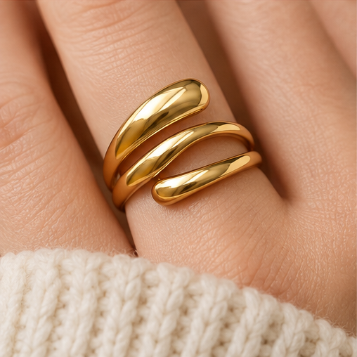 Adjustable gold wrap ring styled on hand for an everyday jewelry look