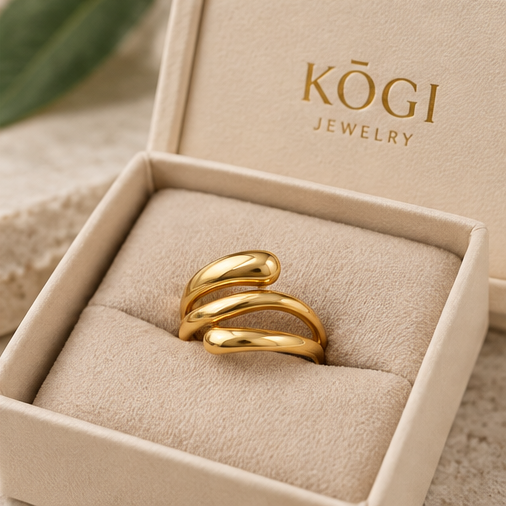 KOGI sculptural triple band gold ring displayed in jewelry gift box