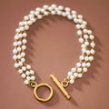 18k gold plated multi-strand pearl bracelet on brown background by Kogi Jewelry