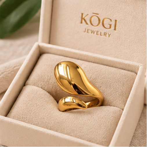 KOGI sculptural teardrop gold ring displayed in cream jewelry box