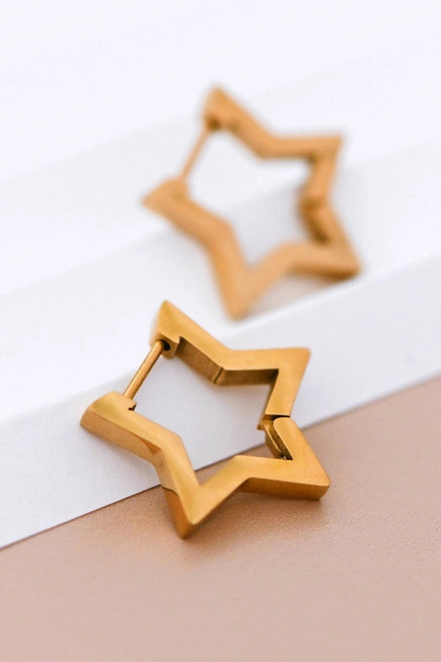 Detailed close-up of the polished surface and sharp lines of the Kogi Jewelry star earrings.