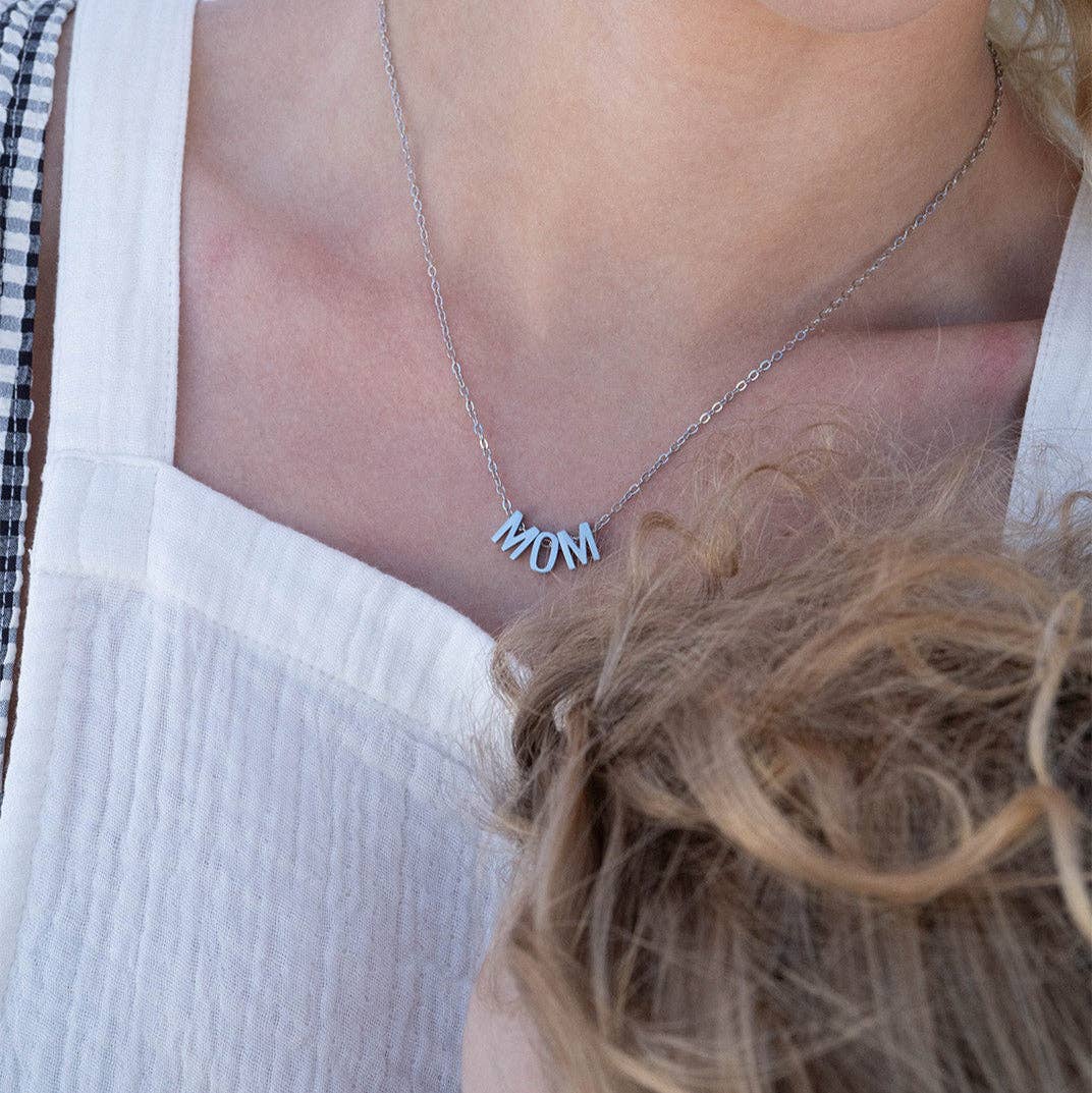 Silver MOM pendant necklace worn for everyday style