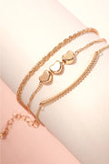 18K gold plated triple layer bracelet with mini heart charms and oval bars by Kogi Jewelry.