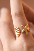 18K gold plated starfish and seashell adjustable ring on a woman's finger by Kogi Jewelry
