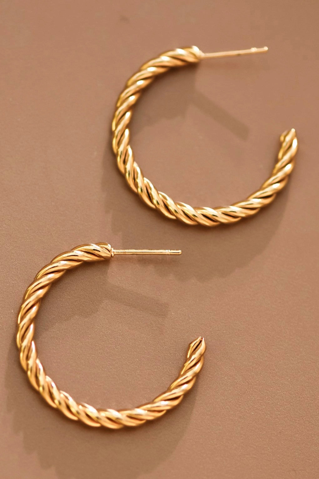 18K gold plated stainless steel twisted rope hoop earrings showcasing the textured intertwined design.