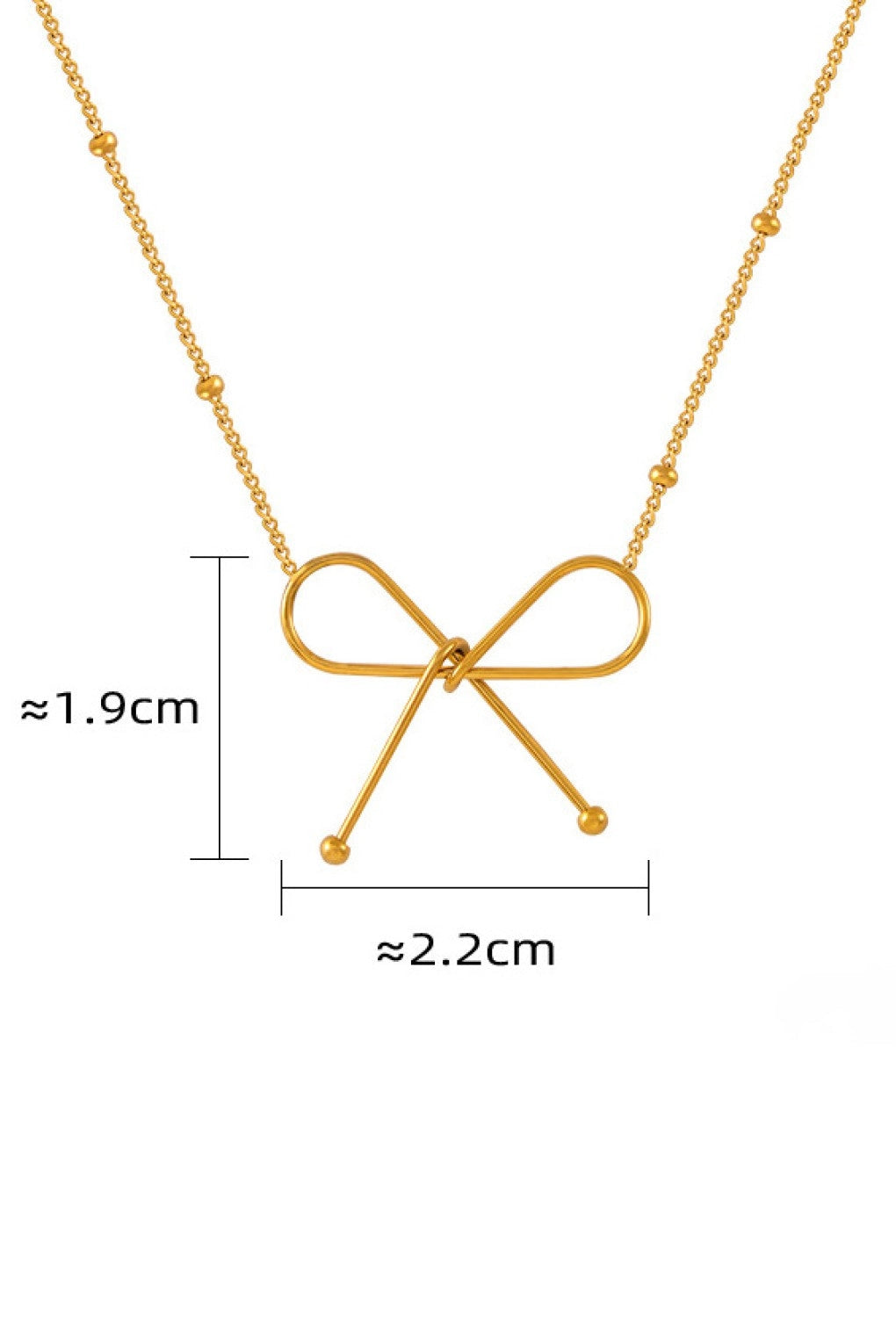 Close-up of the tarnish-free 18K gold bow charm and fine link chain.