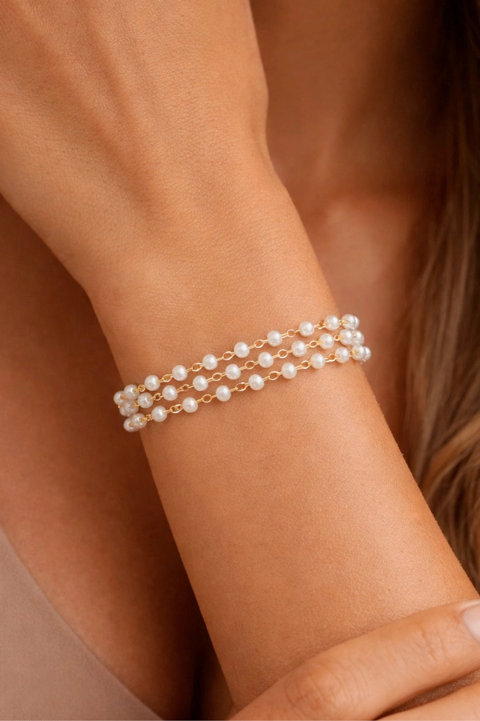 Close-up shot of a waterproof 18k gold plated pearl bracelet for women