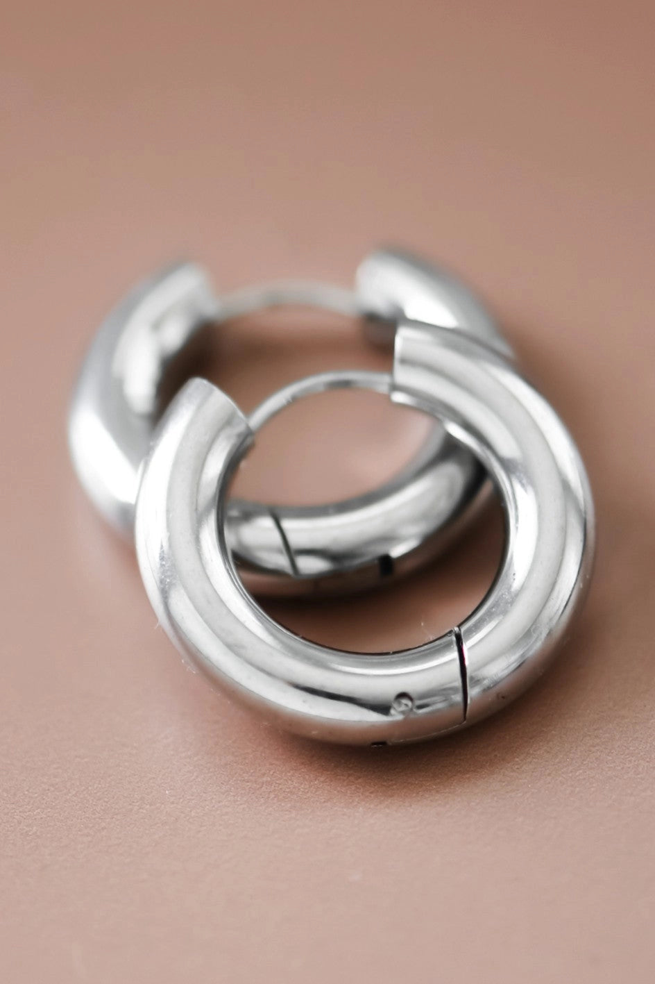 Pair of waterproof and tarnish-resistant silver stainless steel chunky hoop earrings.
